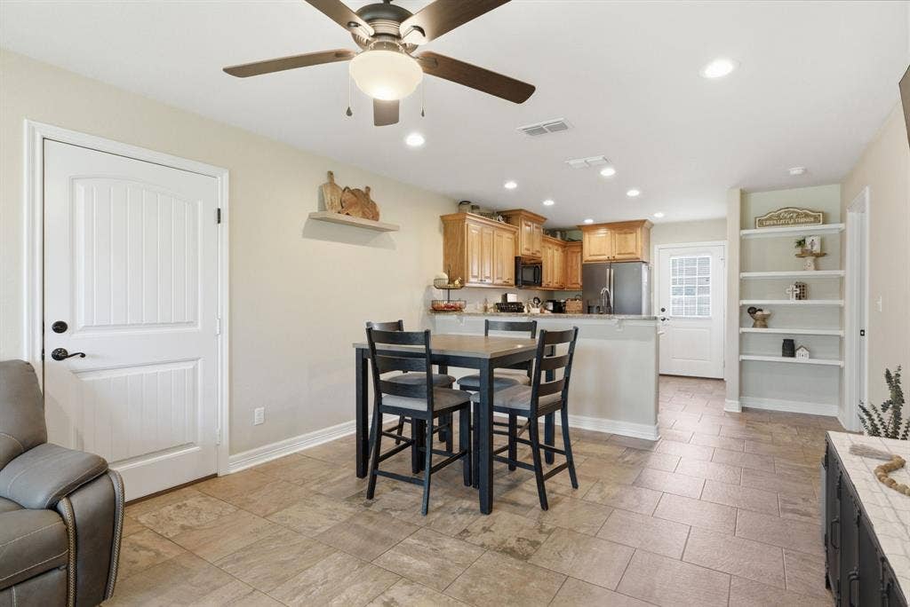 213 Freeman Street, Lindale, TX 75771 Open-concept living area featuring a ceiling fan, recessed lighting, and tile flooring