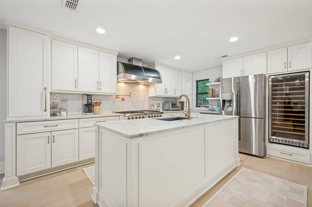 3916 Tumbril Lane, Plano, TX 75023 Quartzite countertops, built-in wine refrigerator