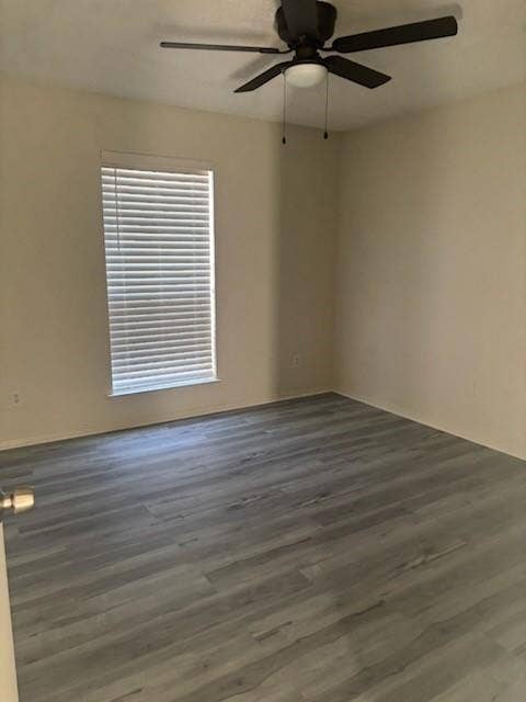 2805 Woodmont Trail, Fort Worth, TX 76133 Room featuring wood-finish flooring, a window with horizontal blinds, and a ceiling fan with integrated lighting