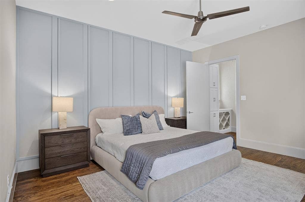 5328 Manett Street, Dallas, TX 75206 Hardwood-style flooring, a ceiling fan with integrated lighting, and board and batten wall detailing