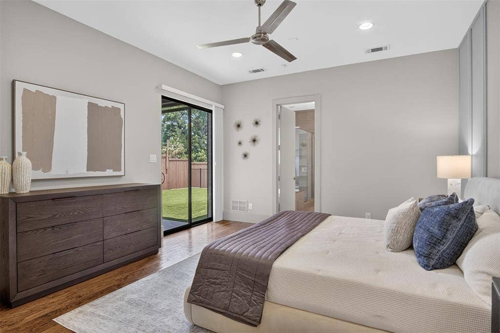 5328 Manett Street, Dallas, TX 75206 Hardwood flooring, recessed lighting, ceiling fan, sliding glass door to exterior, and a paneled accent wall