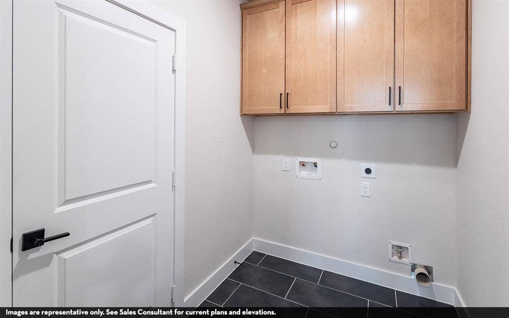 810 Metcalf Drive, Princeton, TX 75071 Light wood-finish cabinetry with matte black pulls