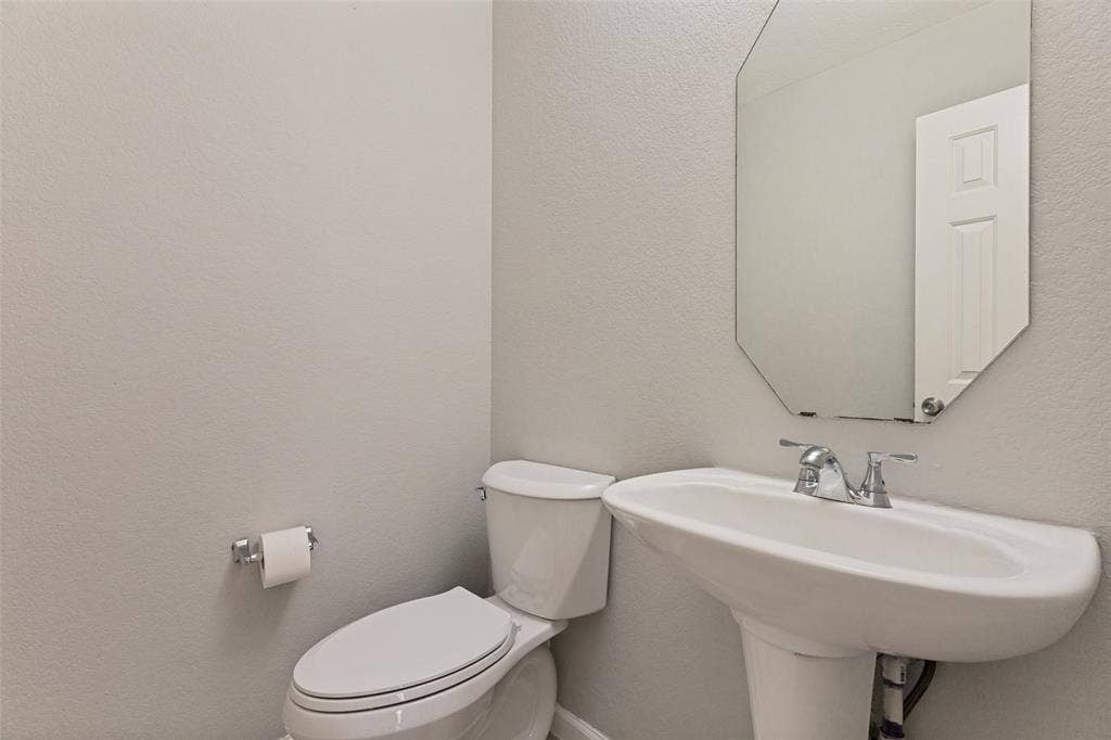Half Bath on 1st Floor near Kitchen.