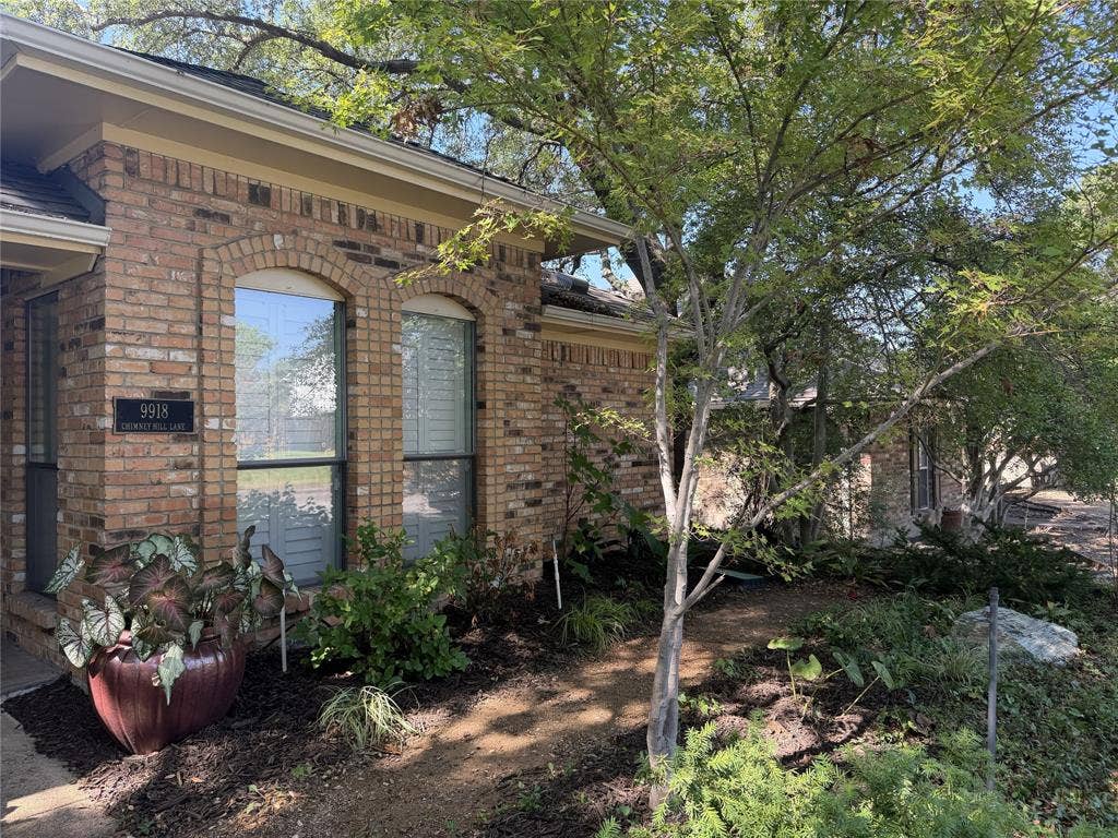 Right front of home gardens feature shade-loving plants and seasonal color.