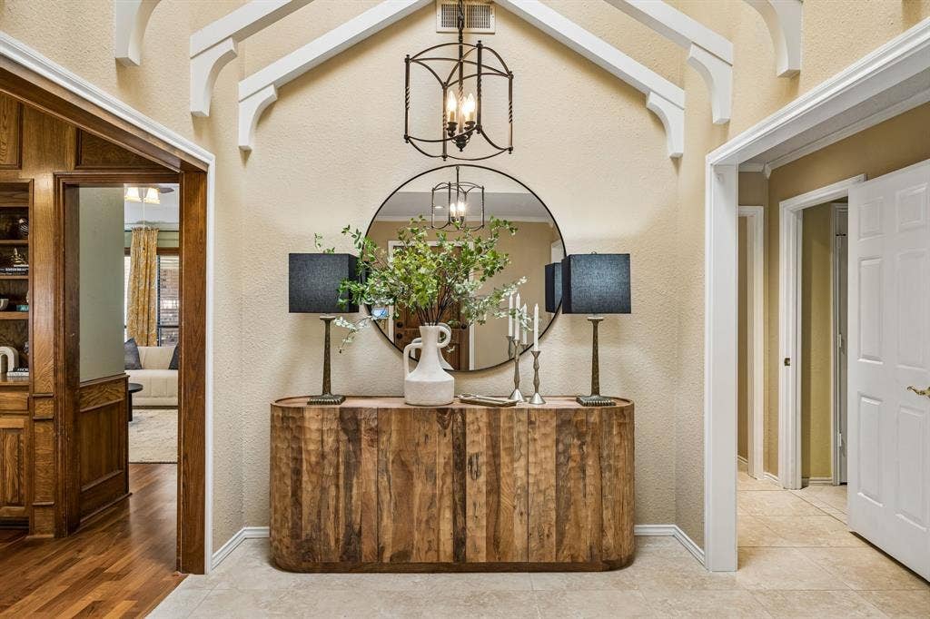 The entry is large and light filled with beautiful architectural details.