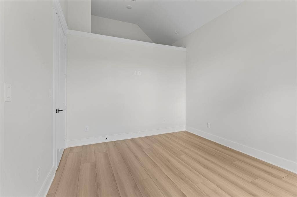 13914 Cedar Hill Lane, Tyler, TX 75704 Recessed lighting, light wood-finish flooring, white walls, white trim, and a white interior door with black hardware