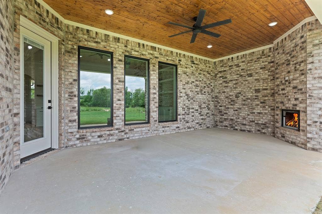 13914 Cedar Hill Lane, Tyler, TX 75704 Covered patio featuring a brick exterior and a wood-finish ceiling
