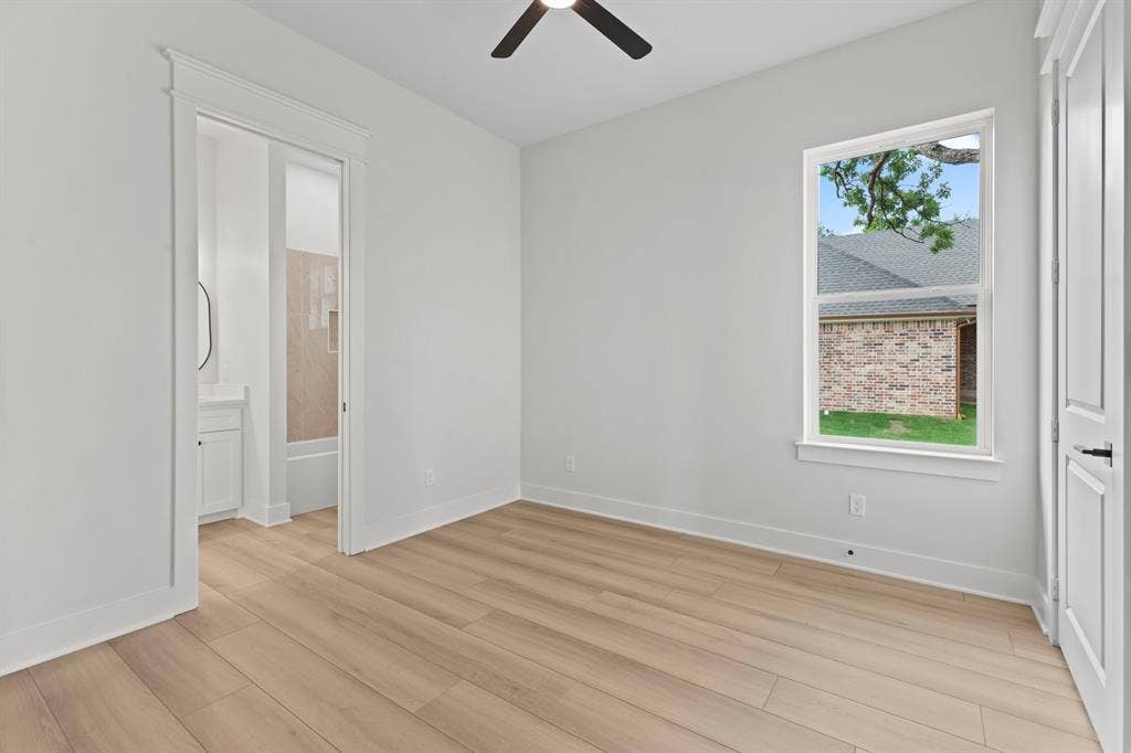 13914 Cedar Hill Lane, Tyler, TX 75704 Wood-finish flooring, white walls, and a ceiling fan