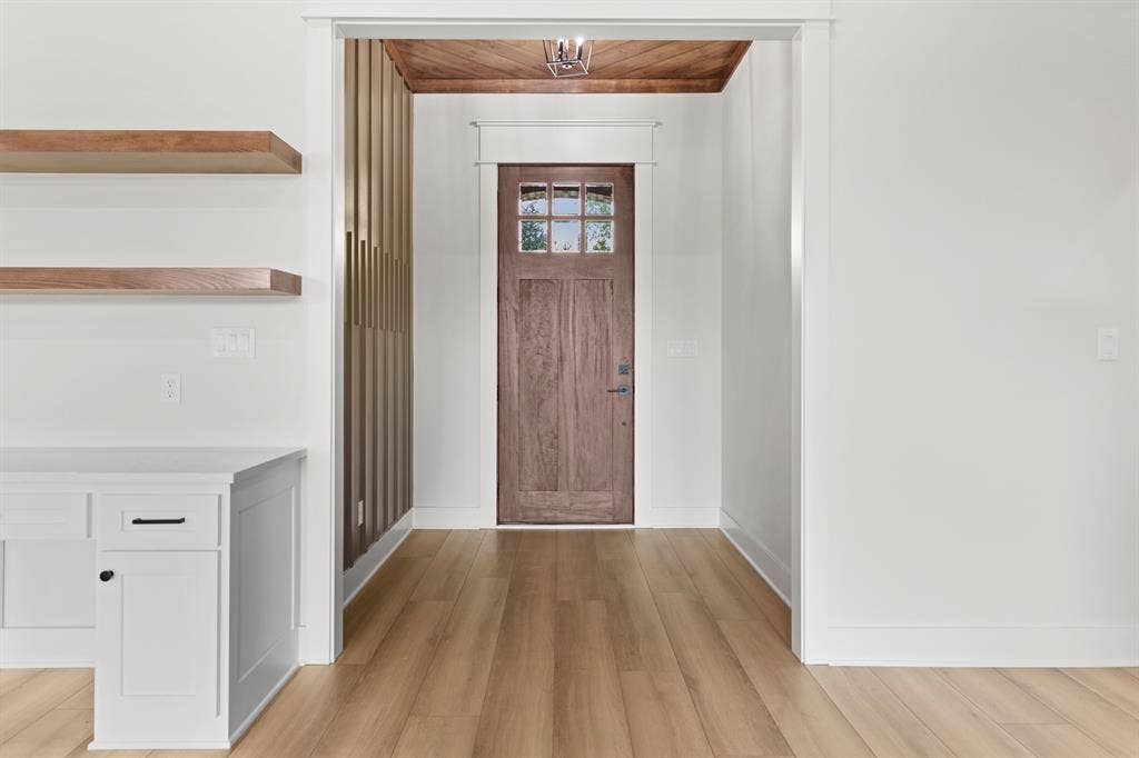 13914 Cedar Hill Lane, Tyler, TX 75704 Wood-finish flooring throughout, framed by white baseboards