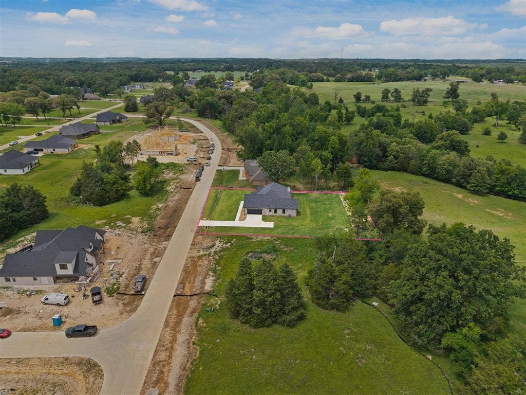 13914 Cedar Hill Lane, Tyler, TX 75704 Expansive lot featuring a newly constructed residence with a dark roof