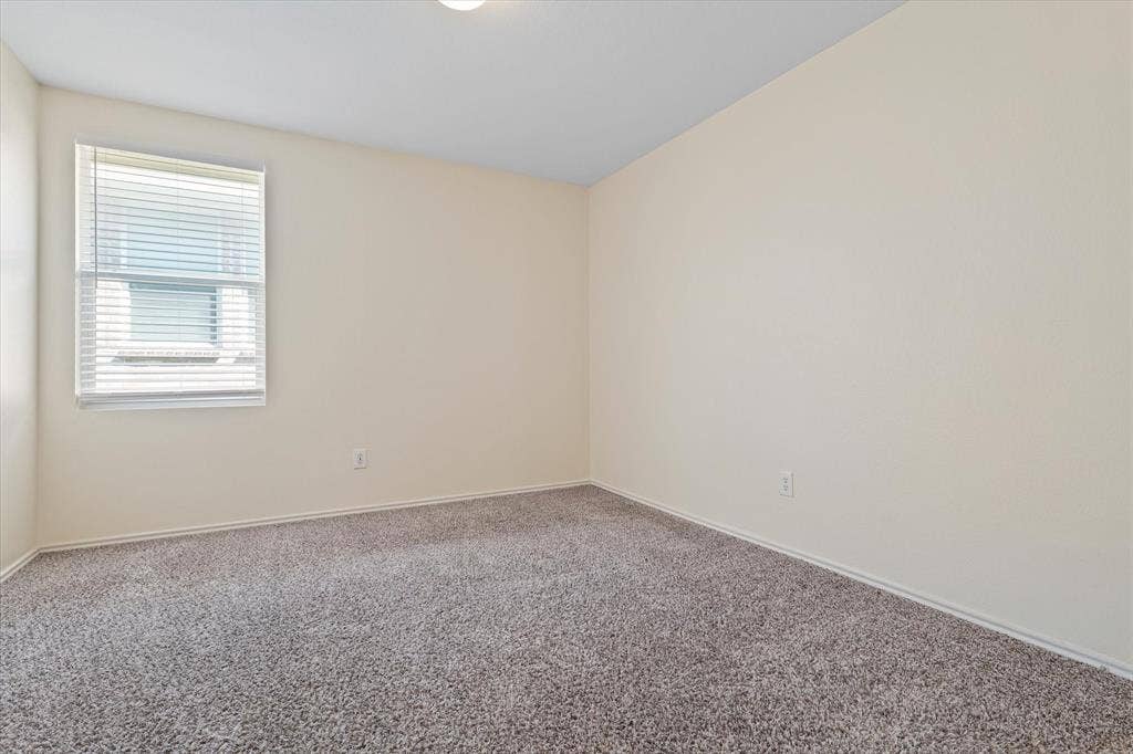 12856 Gillon Drive, Frisco, TX 75035 Carpeted empty room with baseboards