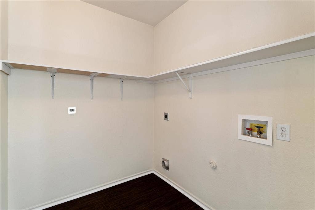 12856 Gillon Drive, Frisco, TX 75035 Washroom featuring electric dryer hookup, washer hookup, and dark wood finished floors