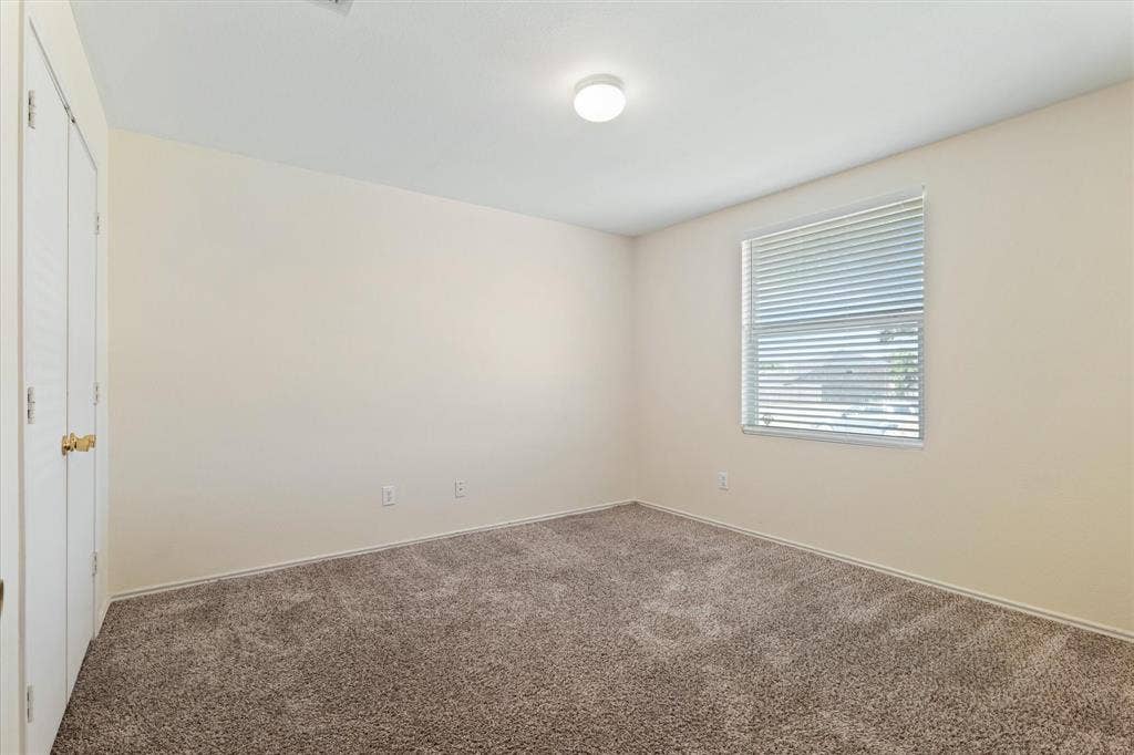 12856 Gillon Drive, Frisco, TX 75035 Empty room with carpet flooring