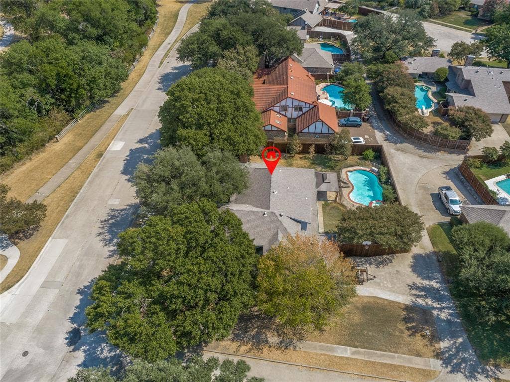 5013 Country Place Drive, Plano, TX 75023 Property with a private pool, mature trees, and a concrete driveway, view of park across the street with expansive walking trail, play areas and creek views