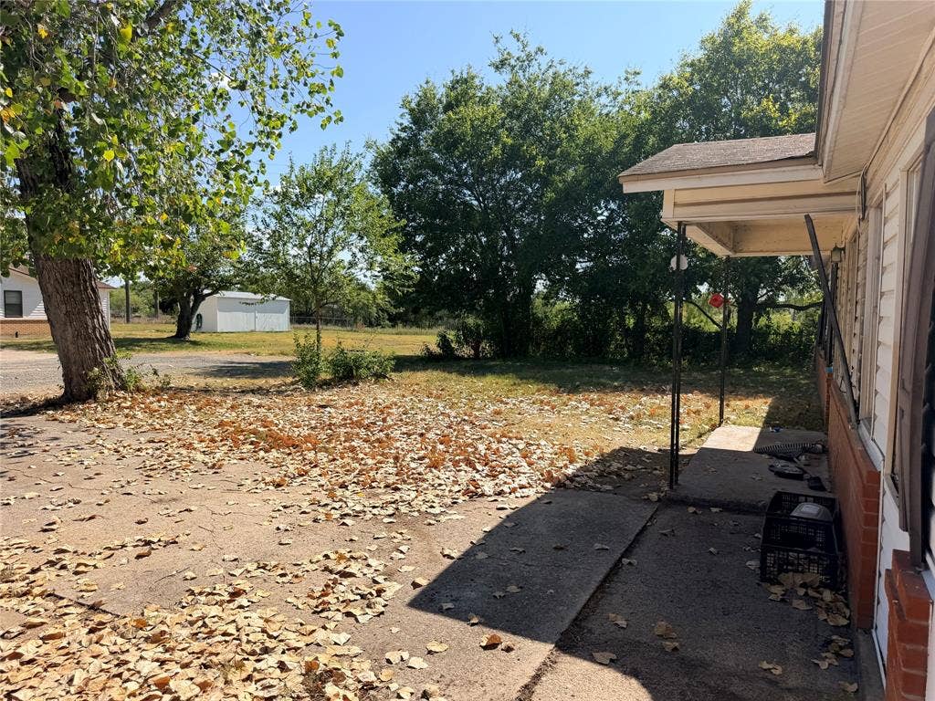 313 Lawndale Street, Robinson, TX 76706 Concrete porch with metal supports, exterior siding, and brick foundation