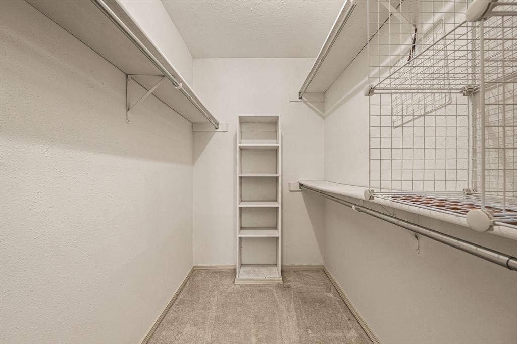 Large walk-in closet in primary bathroom