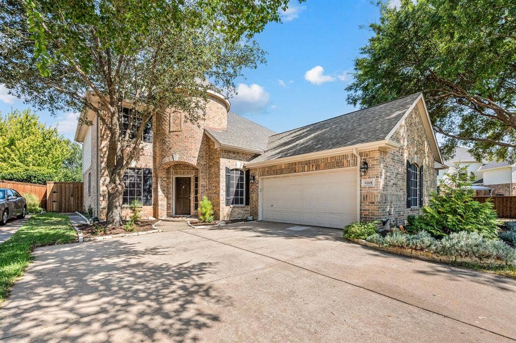 6201 Crator Drive, McKinney, TX 75070 Brick exterior with a prominent turret, attached two-car garage, and mature tree landscaping and just an over all great curb appeal to this wonderful home!