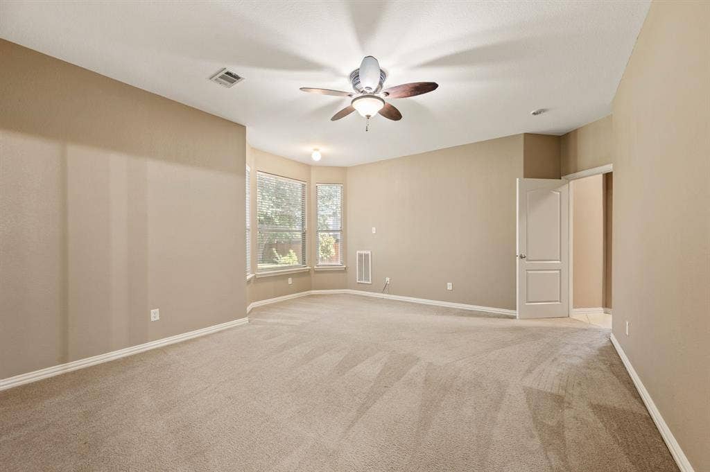 6201 Crator Drive, McKinney, TX 75070 Fabulous size primary bedroom with large bay windows that let in wonderful natural light. There is more than enough room in this bedroom for your large furniture!