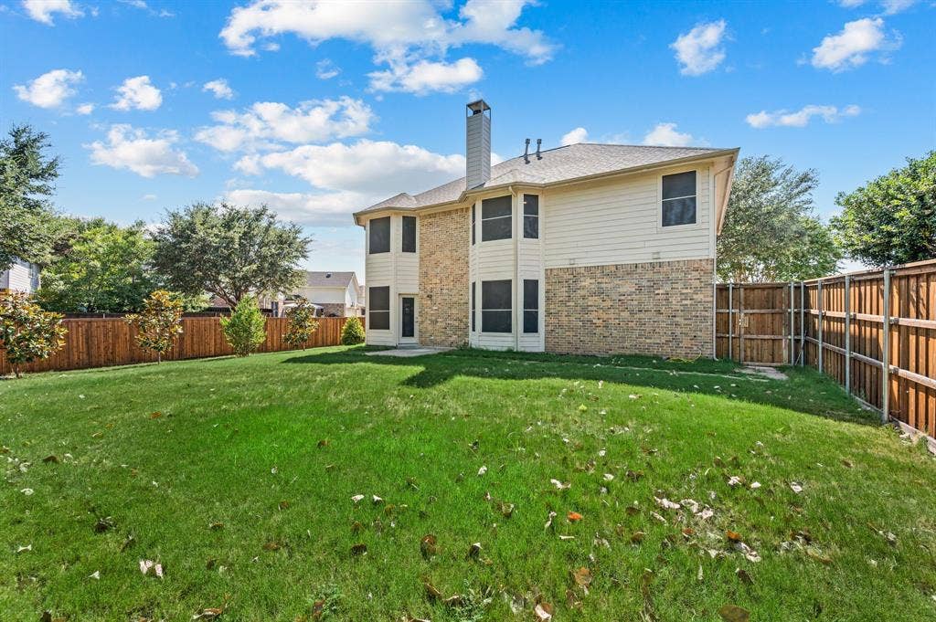 6201 Crator Drive, McKinney, TX 75070 Expansive grassy yard with new board on board privacy wood fencing and mature perimeter trees