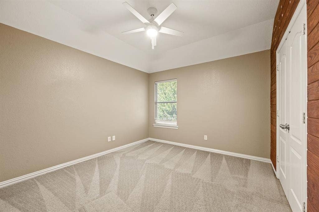 6201 Crator Drive, McKinney, TX 75070 Guest bedroom upstairs with a ceiling and decorative wall.