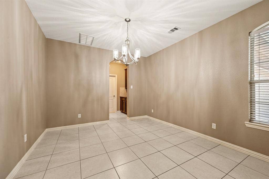 6201 Crator Drive, McKinney, TX 75070 Formal dining room with fresh paint and wonderful natural light and new lighting for your formal meals or if you prefer to use it for another room it can be anything you would like maybe another living space or library...