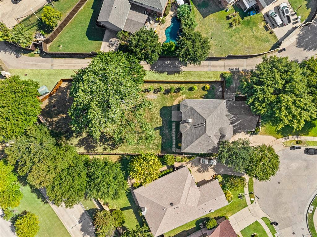 6201 Crator Drive, McKinney, TX 75070 Ariell view where you can truly see how large this lot is ....Gable roofline, attached garage, paved driveway, mature trees, and a landscaped yard with established shrubbery