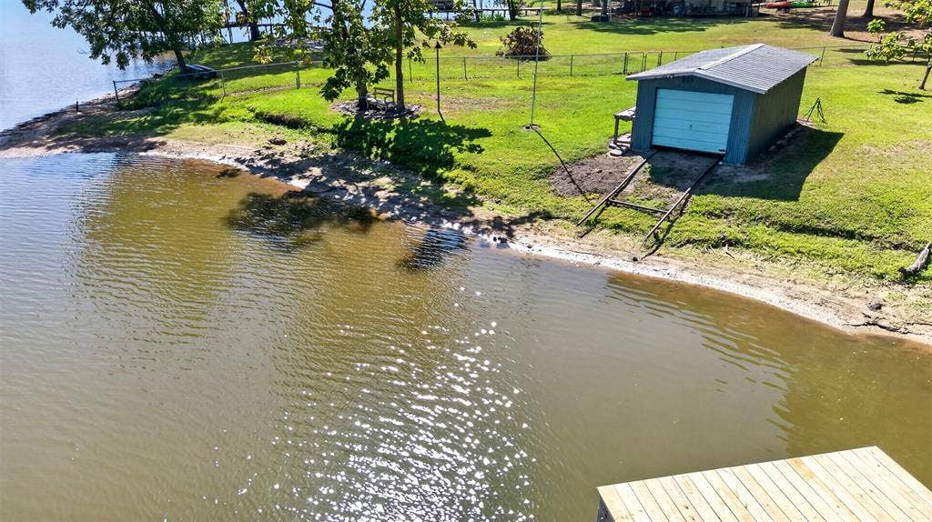 21165 Charina Circle, Chandler, TX 75758 Waterfront beach with onland boat house