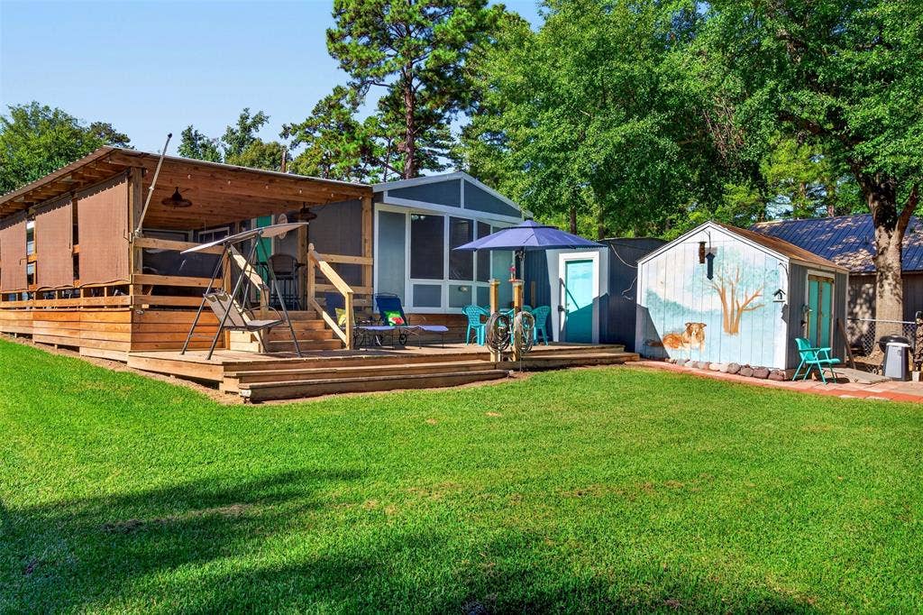 21165 Charina Circle, Chandler, TX 75758 This deck is out on the property under the trees