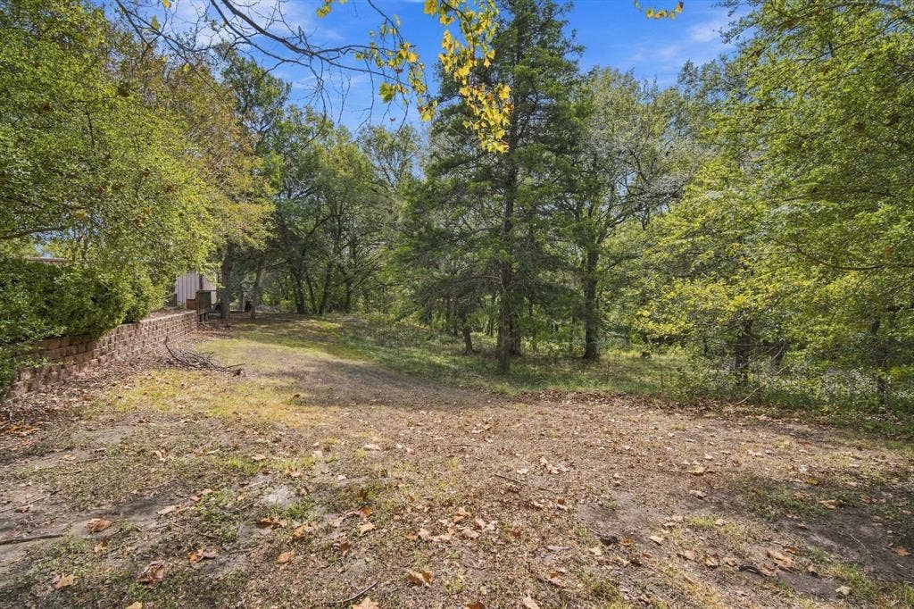leading back to the wooded acres.