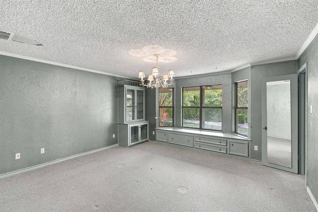Secondary bedroom with huge walk in closet and connecting bath, built ins and window seat.