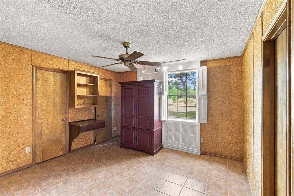 Secondary bedroom with dual closets and connecting bathroom