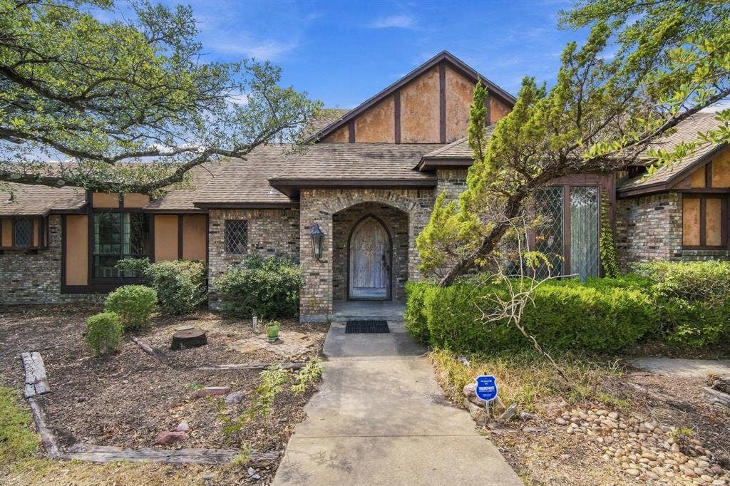 Welcome to 7210 Shiloh Rd. Midlothian, TX where  this Texas sized Estate meets Old World Charm in this English Tudor!