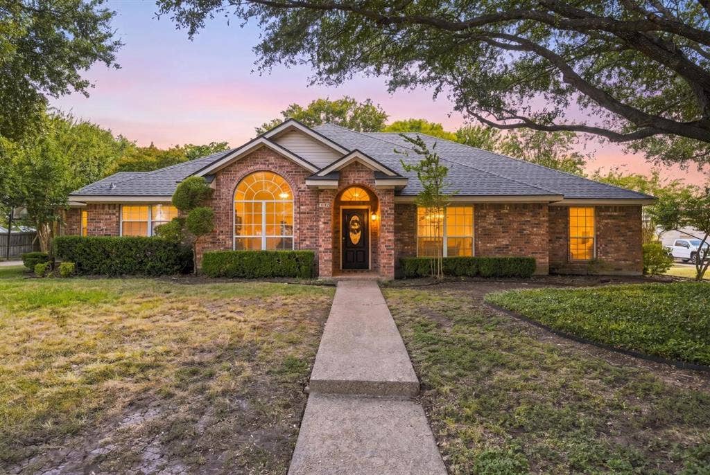 512 Meadowland Drive, Waco, TX 76657 Brick exterior with a gabled roofline and an arched window