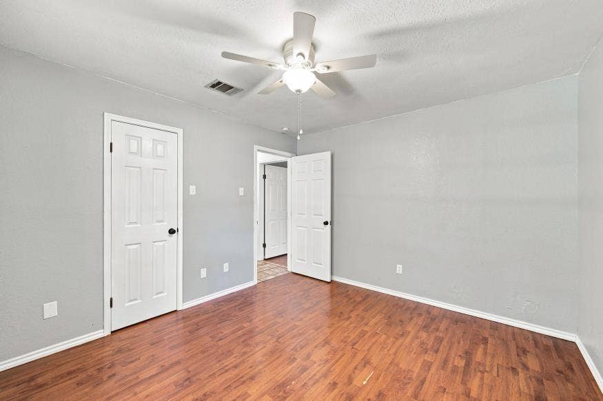 512 Meadowland Drive, Waco, TX 76657 Wood-finish flooring with light gray wall tones and white trim