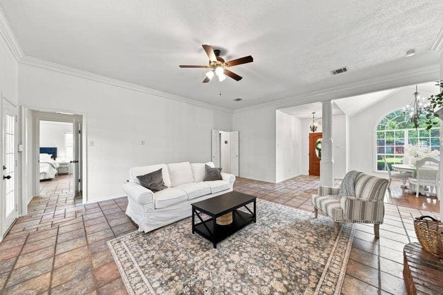 512 Meadowland Drive, Waco, TX 76657 Tile flooring throughout with crown molding and a ceiling fan