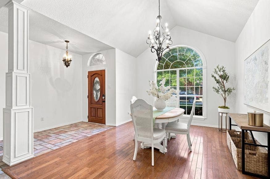 512 Meadowland Drive, Waco, TX 76657 Vaulted ceiling, arched window, wood-finish flooring, decorative column, and solid wood entry door with oval glass insert