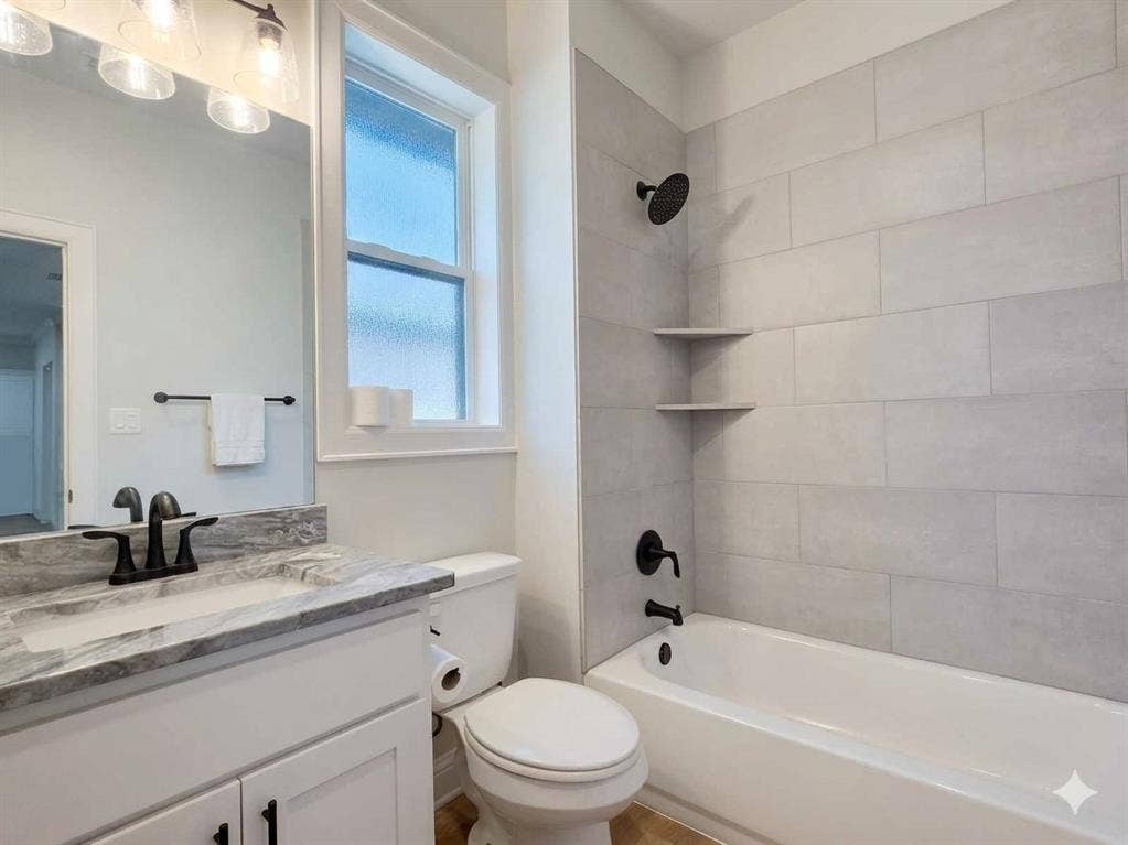 11034 Oak Springs Cove, Tyler, TX 75703 White vanity with a stone-finish countertop, undermount sink, and matte black faucet