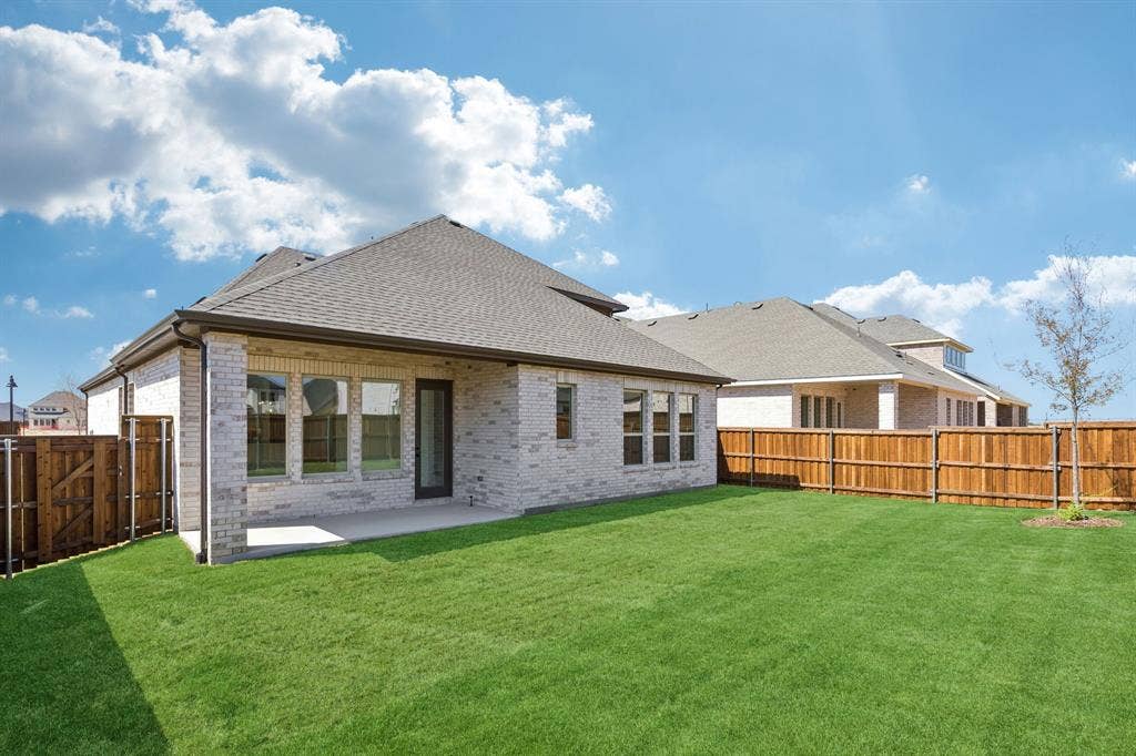 1820 Vetiver Glow Drive, Celina, TX 75009 Plenty of outdoor family fun time to be had in this wonderful fenced back yard with covered patio!