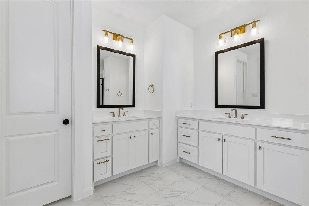 1820 Vetiver Glow Drive, Celina, TX 75009 His and her vanities are just one of the many sought after features in this lovely owner's bath.