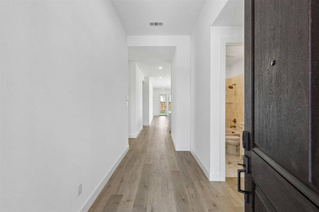 1820 Vetiver Glow Drive, Celina, TX 75009 Featuring sight lines from the front through to the rear of the home, you'll love inviting friends and family into your new home!