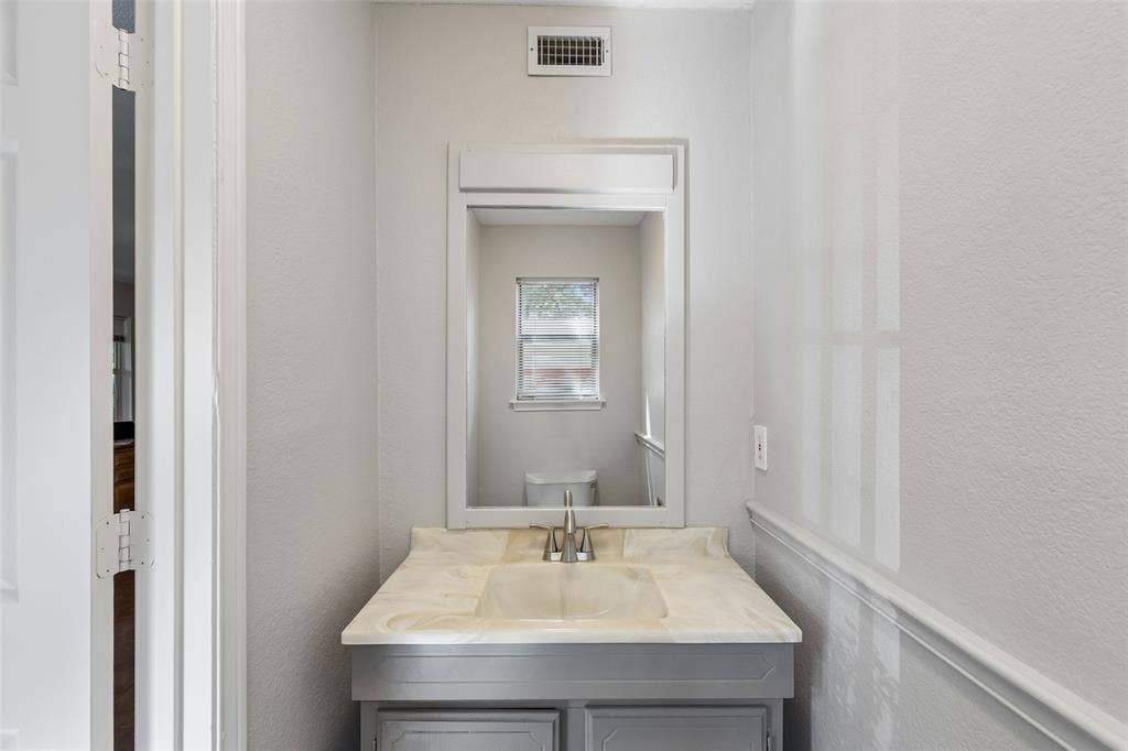 1012 Spanish Trail, Keller, TX 76262 Digitally Staged. Office/Flex/Bedroom - Lower Level with Ensuite Half Bathroom. Can be used as a bedroom.