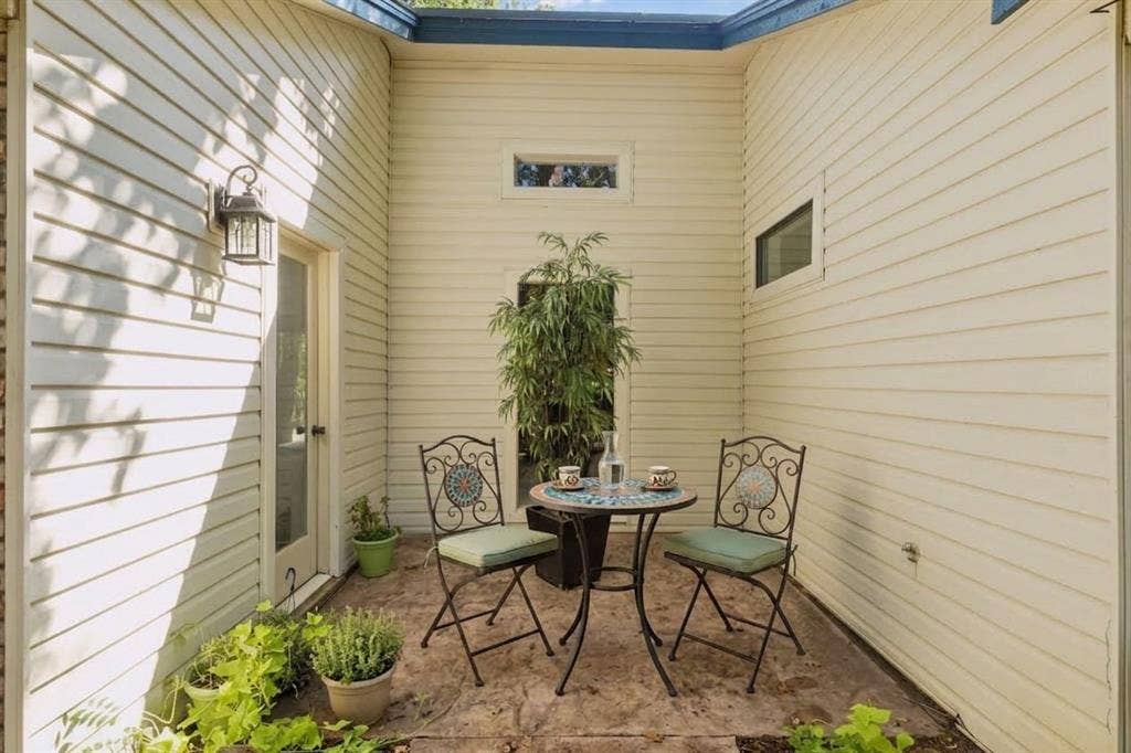 1012 Spanish Trail, Keller, TX 76262 Digitally Staged. Side Patio off Living Room.