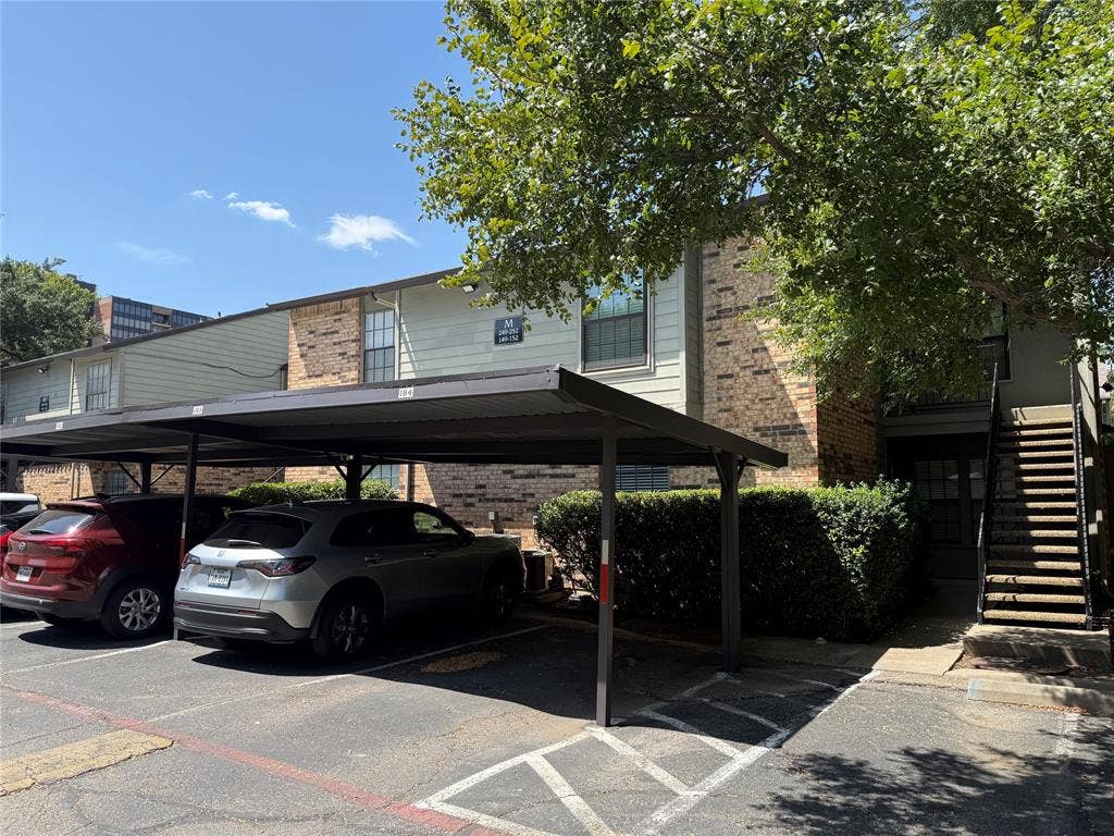 5335 Bent Tree Forest Drive, #150, Dallas, TX 75248 Brick and siding exterior with mature landscaping