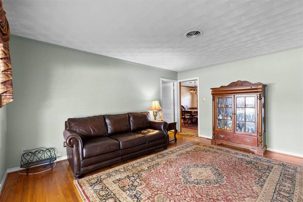 1013 Bandera Lane, Garland, TX 75040 Light green painted walls with crown molding