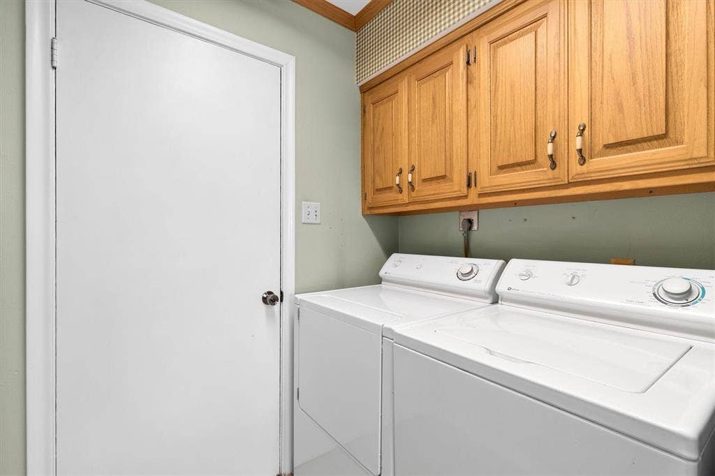 1013 Bandera Lane, Garland, TX 75040 Built-in cabinetry with wood-finish doors and decorative hardware