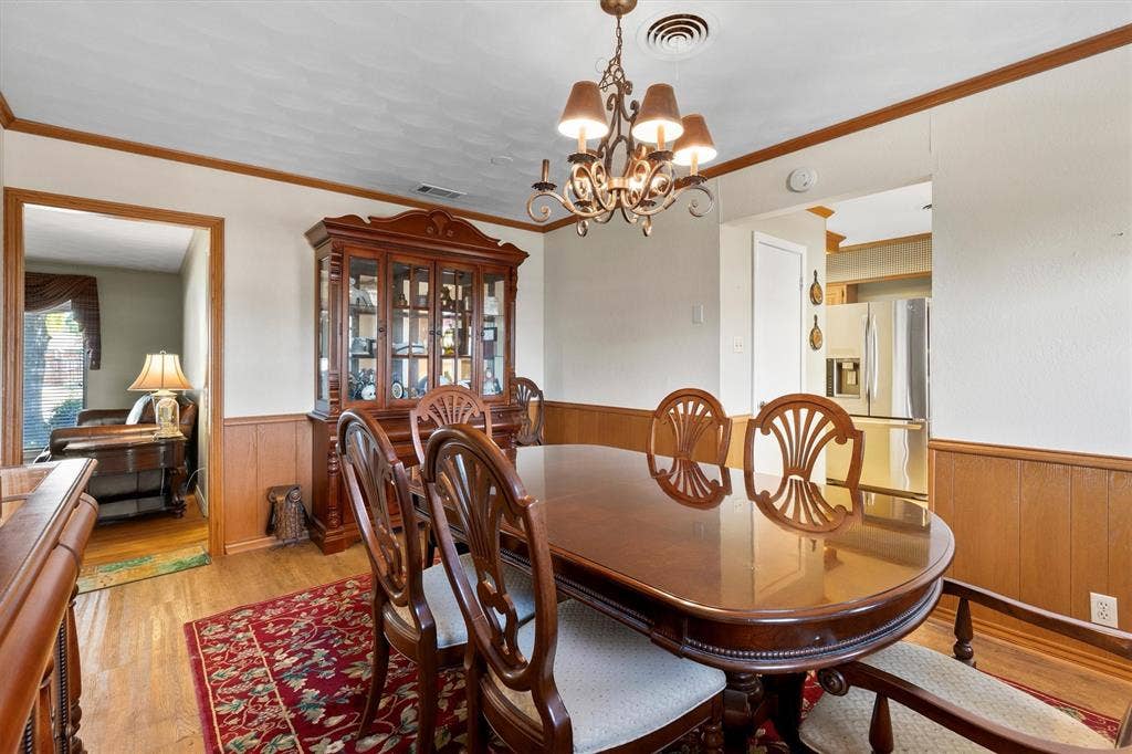 1013 Bandera Lane, Garland, TX 75040 Wood-finish flooring, wainscoting, and crown molding