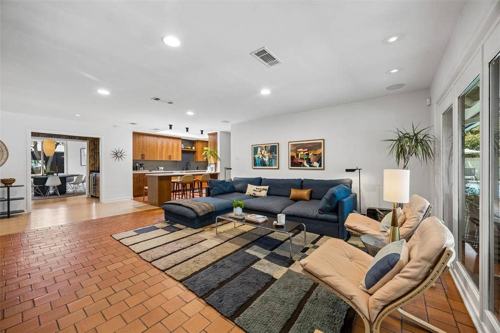 A warm and comfortable family room flows into the beautifully appointed kitchen.
