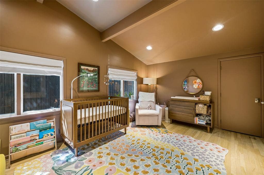 Guest bedroom with vaulted ceiling.