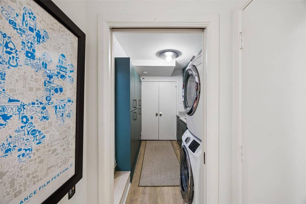 Nice utility room with laundry, storage and pantry.