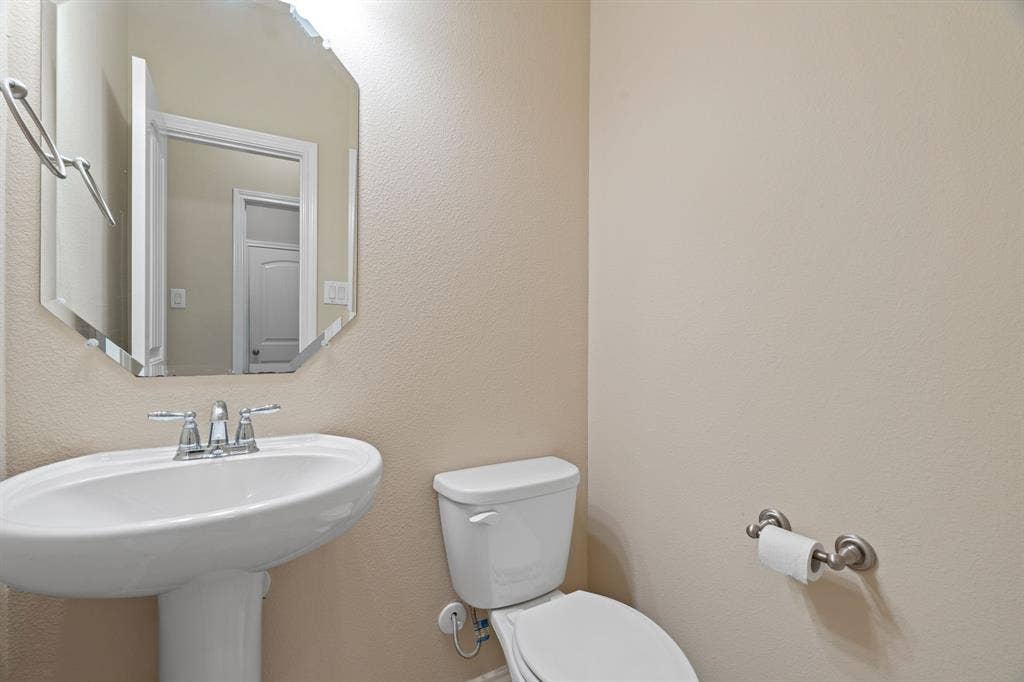 1704 Sparrow Street, Argyle, TX 76226 Half bath across from laundry room